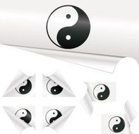 Yin Yang symbols behind Curled Paper