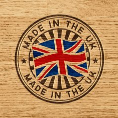 Made in the UK Stamp on wooden background