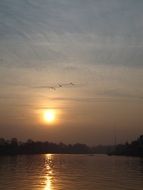 sunset over water at dusk