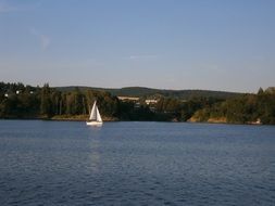 sailing boat on lake at summer