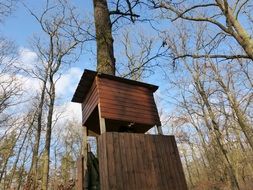wooden camouflage hut in the forest
