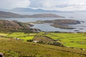 panoarma green fields on the ocean in Ireland