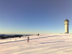 tower on snow mountain