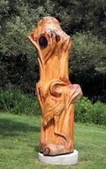 wooden sculpture of a bird in the park
