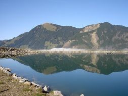 fenced reservoir in mountain landscape