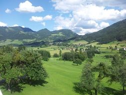 valley against the backdrop of the Alps