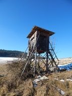 wooden tower in the winter field