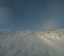 the mountain is covered with white snow