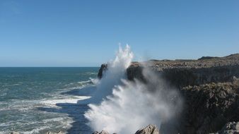 landscape of surf on the rocky shore