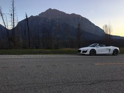 Audi car on a road at dusk
