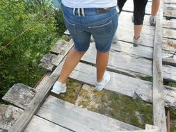 people walk on the wooden flooring