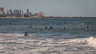 people surf on the beach