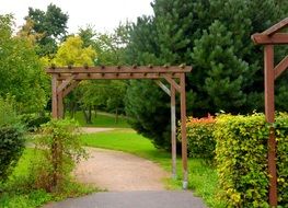 Wooden arches in green garden