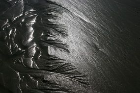 black sand on the beach