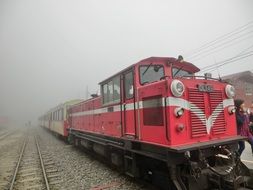 red train on railway in taiwan