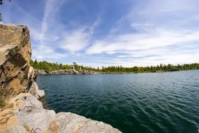 Rock coast lake blue sky water landscape