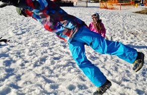 snowboarder is jumping on a snowy slope