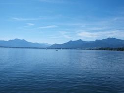 panorama of blue lake Chiemsee on a background of mountains