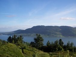 view of the green hills near the lake