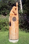 landscape of a wooden sculpture of a beaver in nature