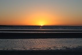 beautiful cloudless sunset on the beach