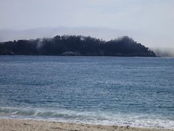 haze over an ocean beach in california