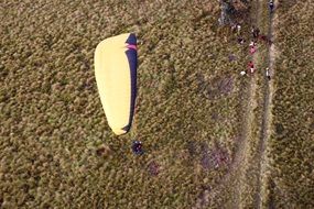 paragliding over the field