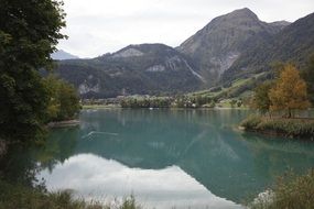 landscape of blue mountain lake in switzerland
