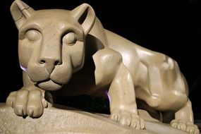 statue of a mountain lion near the temple