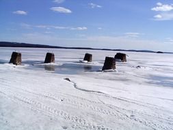 concrete pillars in a frozen lake