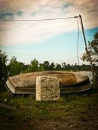 Boat in the grass near the water