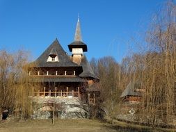 monastery in the forest on a sunny day