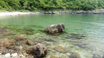 coastal zone on a lake with stones