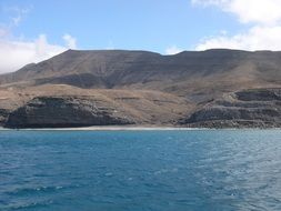 mountain landscape near a lake with blue water