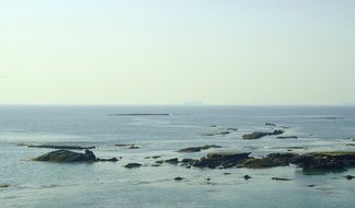 panoramic view of coastal cliffs in the water