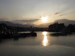 the sun's reflection on the water at sunset