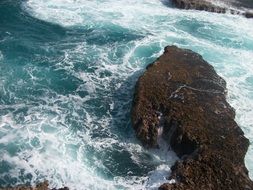 waves beat on rocks