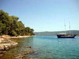 sailboat off the coast of the tourist island