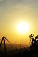 bright orange sun in the sky at sunset