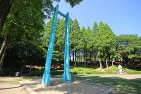 high blue swings in the forest