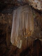 stalactites in a dark cave