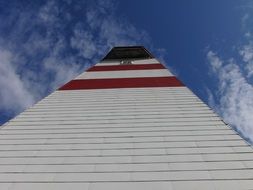 white lighthouse with red stripes