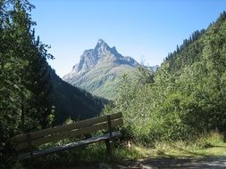 bench for resting in the alpine mountains