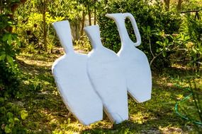 white figures in the garden