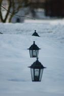 lanterns in deep snow