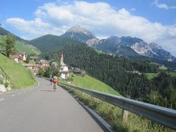 people riding bicycles on the mountain