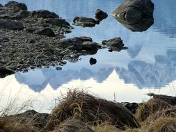 Mountain dachstein reflected in the water