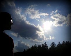 A person and clouds