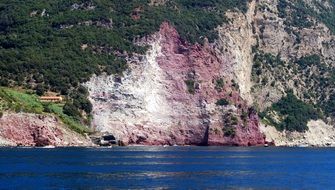 pink mountain on the coast in Italy