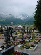 Tyrolean cross at the cemetery in the mountains